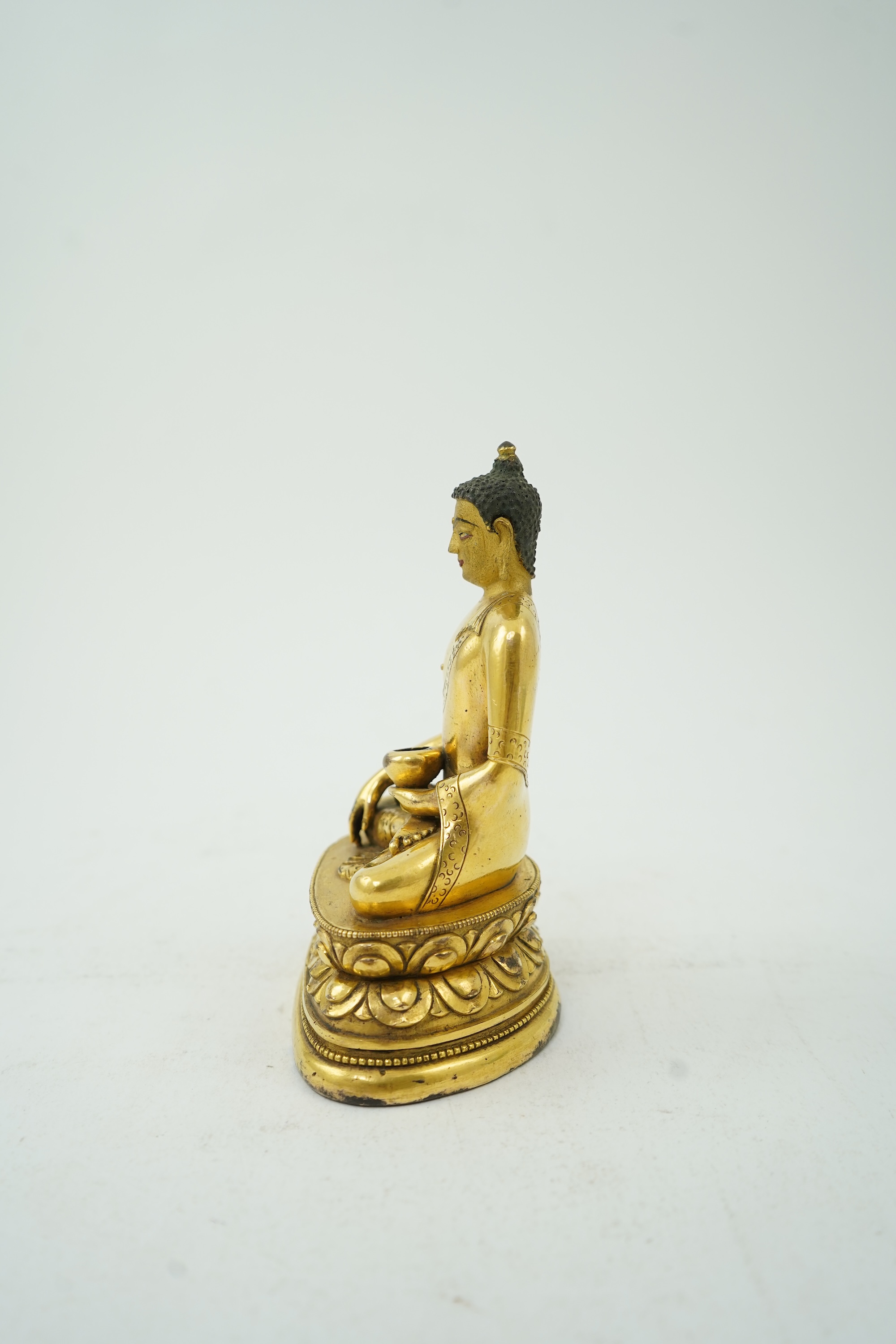 A Mongolian gilt-bronze figure of Buddha Shakyamuni, possibly 18th century
